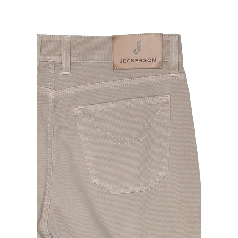 Beige corduroy jeckerson men trousers with tan leather brand patch on waistband made from cotton blend pique