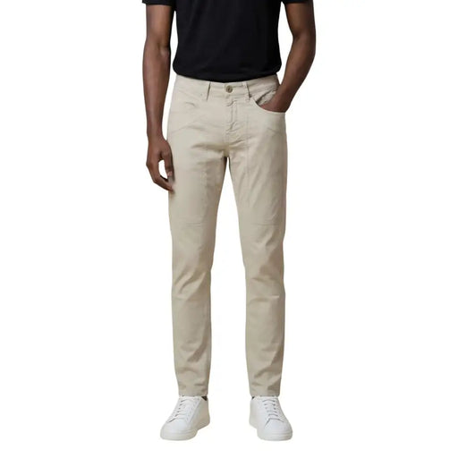 Beige slim-fit denim jeans with five-pocket design and button closure from jeckerson men trousers collection
