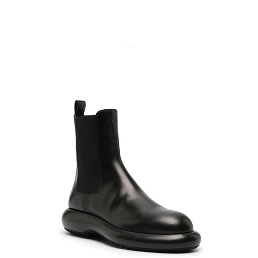 Jil Sander men black leather ankle boot with chunky sole and elastic side panels from fall winter collection