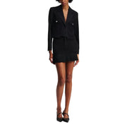 Women’s black cropped blazer and mini skirt set with pointed-toe Mary Jane shoes for fall winter fashion