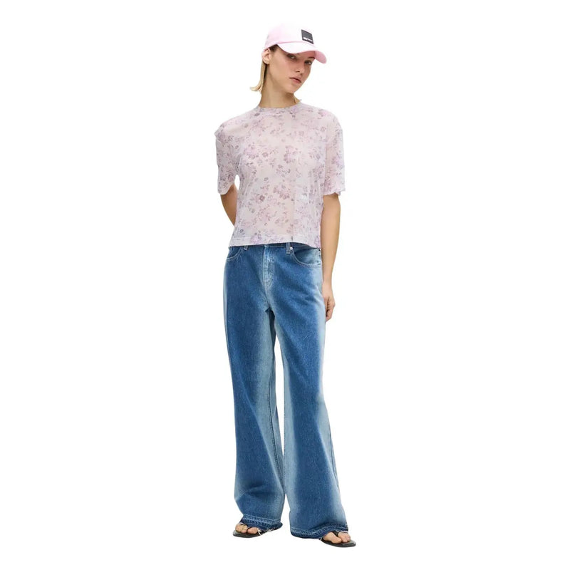 A light pink Karl Lagerfeld Jeans women t shirt with short sleeves sheer floral mesh fabric and round neck