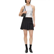 Black pleated mini skirt with front bow detail paired with karl lagerfeld jeans women sleeveless silver cotton top