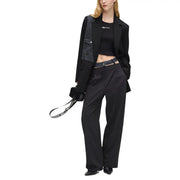 Black leather shoulder bag with bold white logo strap paired with karl lagerfeld jeans women’s black blazer with lapel collar