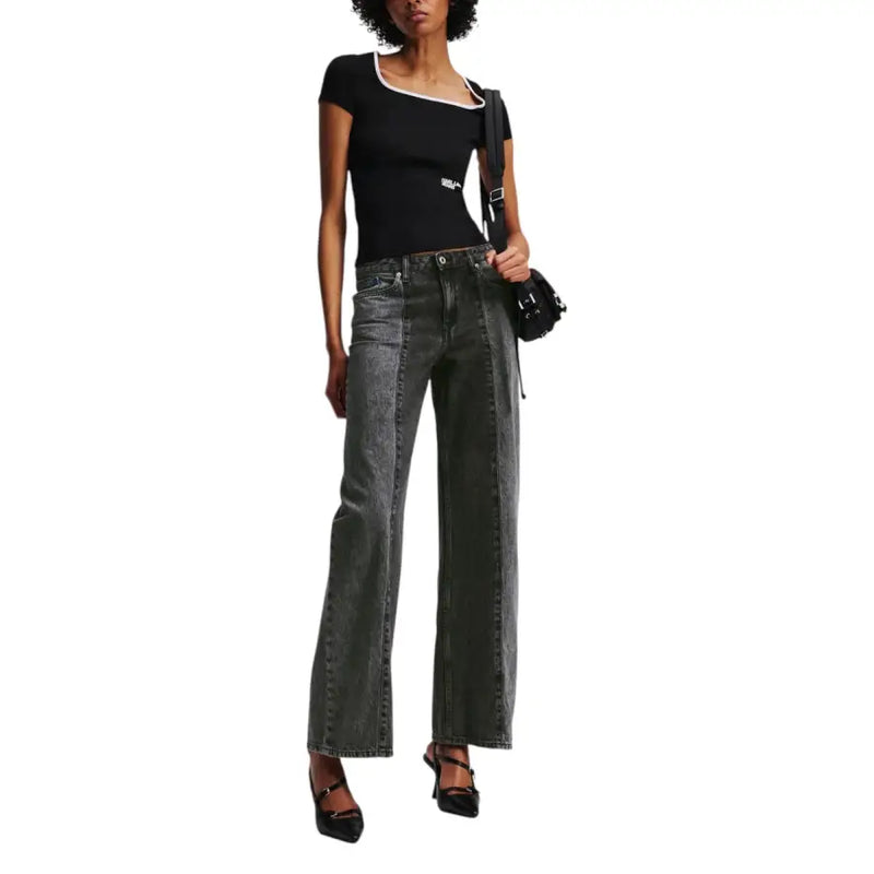 Black short-sleeve top with white trim paired with dark gray wide-leg jeans by Karl Lagerfeld Women