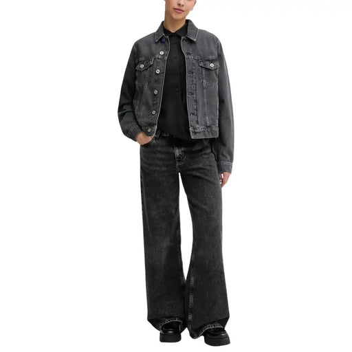 Karl lagerfeld women’s black organic cotton jeans paired with a black denim jacket featuring button-front and flap pockets