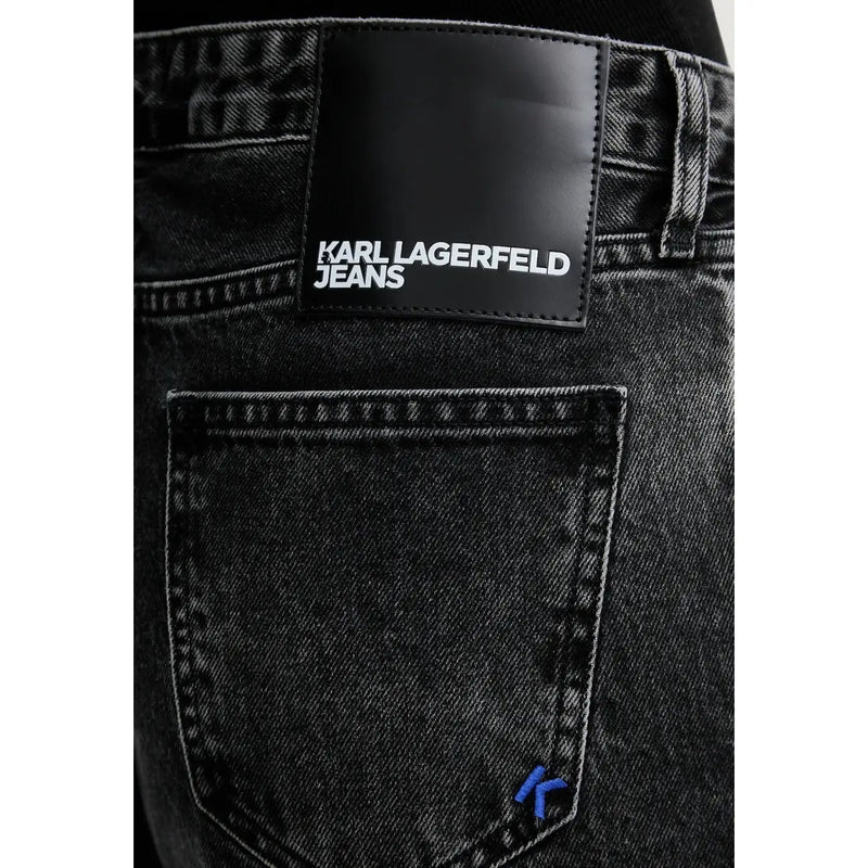 Black denim jeans with black leather karl lagerfeld patch and blue embroidered logo on pocket made from organic cotton