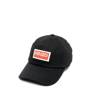 Black Kenzo Paris men’s baseball cap in cotton featuring a rectangular orange and white logo patch on the front