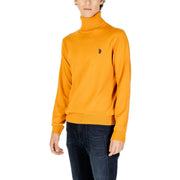Mustard yellow turtleneck sweater with polo logo.