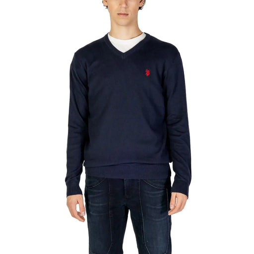 Navy blue knitted v-neck sweater with small red embroidered logo on left chest from knitted clothing collection