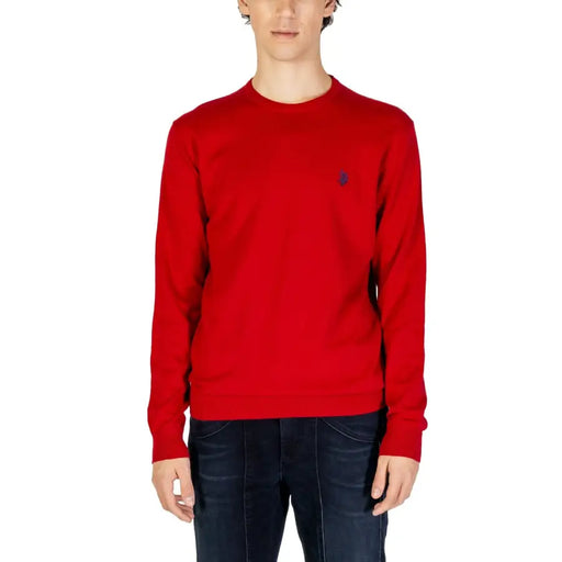 Red knitted long-sleeved crewneck sweater with small dark embroidered logo on left chest from knitted clothing collection
