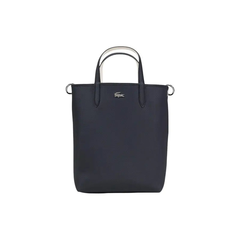 Lacoste black zip handbag tote with textured fabric and contrasting white handles featuring shoulder strap and inner pouch