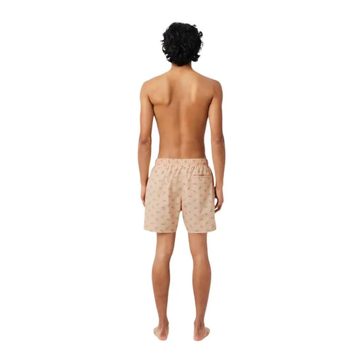 Beige Lacoste Herren-Badeshorts aus Polyester mit rosa Print, dezentem grünem Blattmuster und elastischem Bund