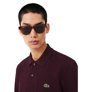 Brown tortoiseshell framed lacoste sunglasses with dark lenses paired with lacoste men purple cotton t shirt