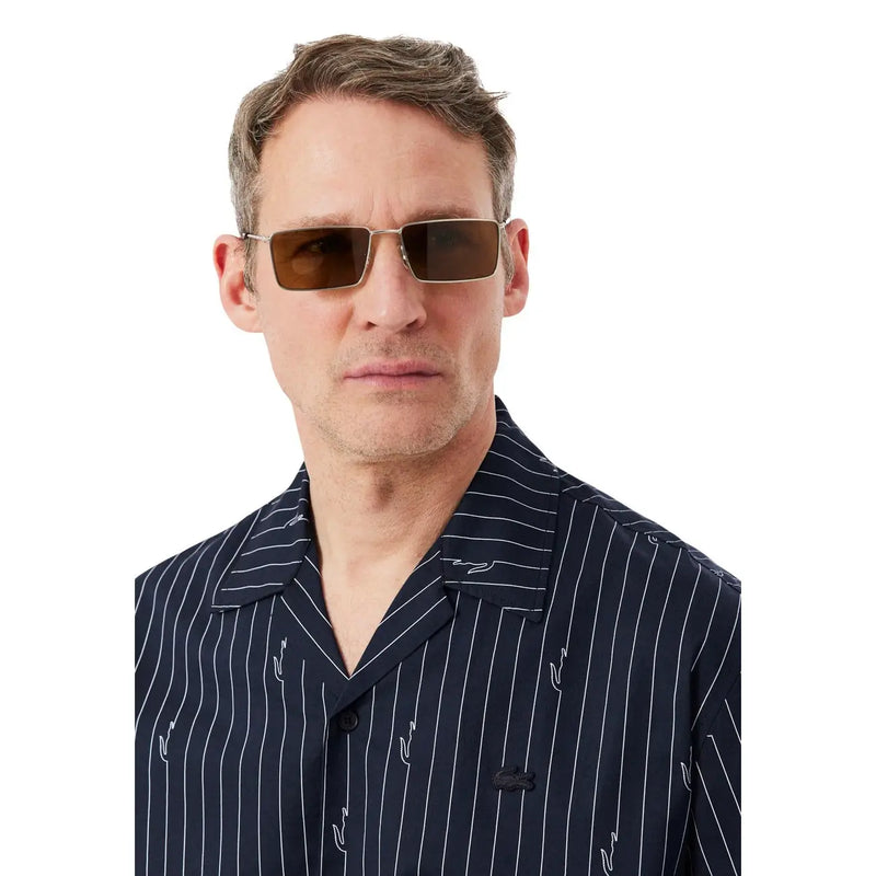 Lacoste men shirt paired with rectangular brown-tinted sunglasses featuring a metallic frame