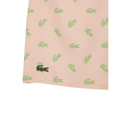 Pink Lacoste men swimwear shorts with repeating light green crocodile pattern and dark green embroidered logo