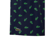 Dark blue Lacoste men swimwear shorts with green crocodile pattern and matching embroidered logo on lower left leg