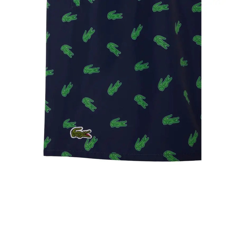 Dark blue Lacoste men swimwear shorts with green crocodile pattern and matching embroidered logo on lower left leg