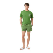 Green short-sleeved Lacoste men swimwear t-shirt with white tennis court graphic on the left chest