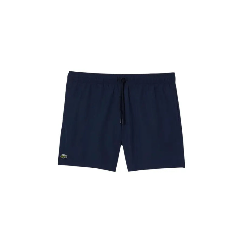Navy blue Lacoste men swim trunks with subtle textured fabric and green crocodile logo on the lower left leg