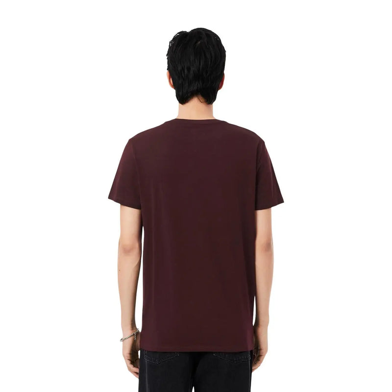 A lacoste mens bordeaux cotton t shirt in maroon with short sleeves and a crew neck design