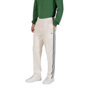 Men’s cream track pants with green and black side stripes from Lacoste for fall winter