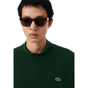 Lacoste-Sonnenbrille für Herren mit dunkelbraunem Schildpattrahmen und schwarzen Gläsern, Vorderansicht