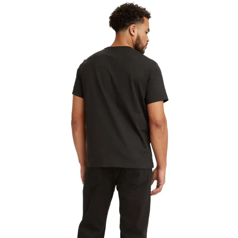 Man wearing Levis Men Black Printed Cotton Round Neck T Shirt and black pants