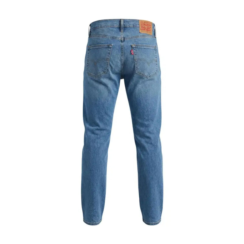 Levi’s men blue denim jeans with classic five-pocket design cotton stretch slim fit showing back side with leather patch