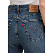 Back side of levis women blue denim cotton jeans regular fit featuring classic brand patch and red tab on pocket