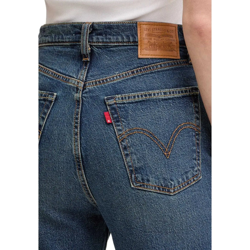 Back side of levis women blue denim cotton jeans regular fit featuring classic brand patch and red tab on pocket