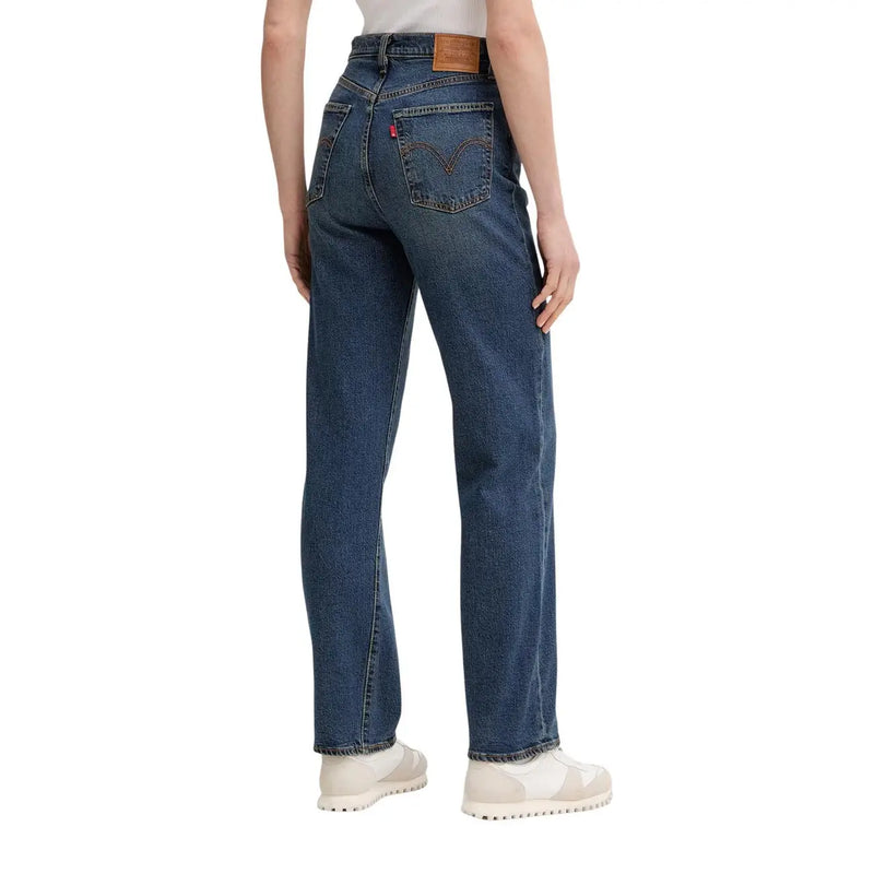 Back side of levis women blue denim cotton jeans regular fit with dark blue five-pocket design and red levi’s logo