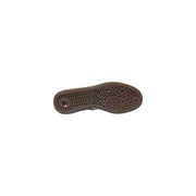 Brown rubber sole with textured pattern and adidas logo on light blue leather women spring summer slip on sneakers