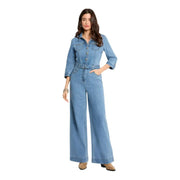 Light blue light-wash denim jumpsuit with button-up front belted waist pockets and three quarter sleeves