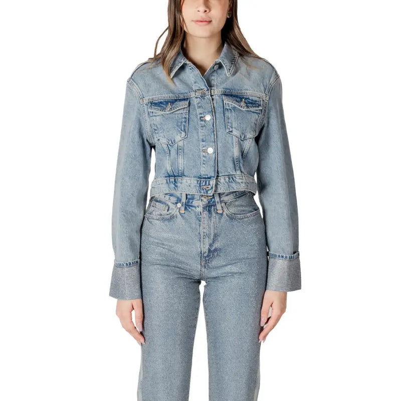 Light blue denim jacket with light-wash fabric, classic collar, button-front closure, and two chest pockets