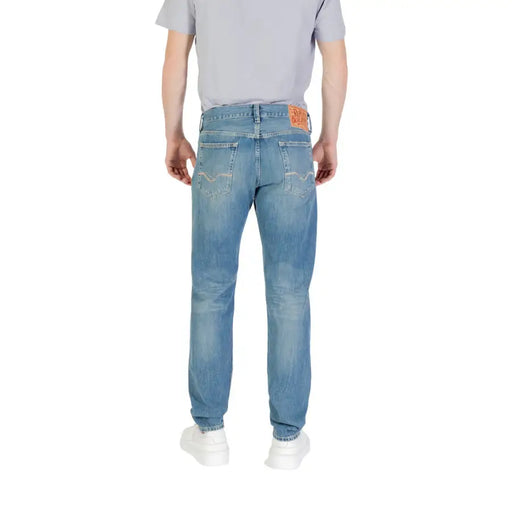 Men’s Light Blue Denim Jeans displayed on a store mannequin