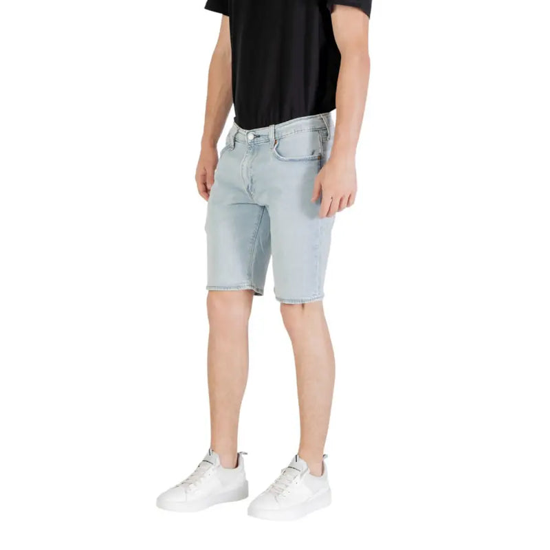Light blue denim shorts with classic five-pocket design and frayed hem in light wash denim material