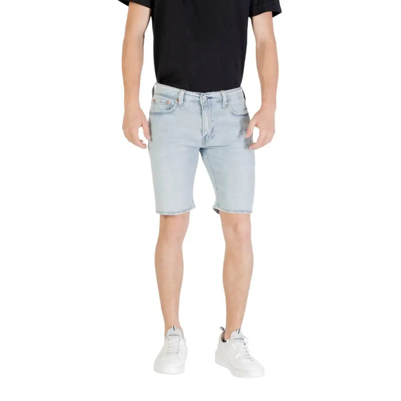 Light blue denim shorts with a classic five-pocket design and frayed hem in light-wash denim material