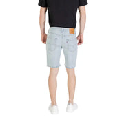 Light blue denim shorts with light-wash fabric classic levi’s design and brown leather patch at the waistband back side view