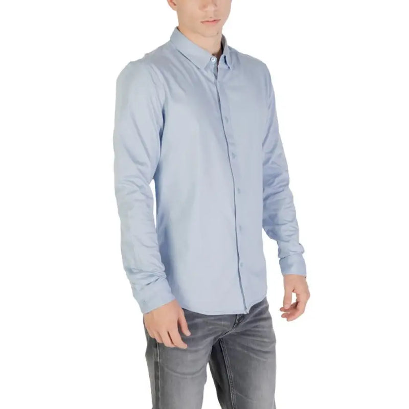 Light blue long-sleeved shirt displayed in the product listing