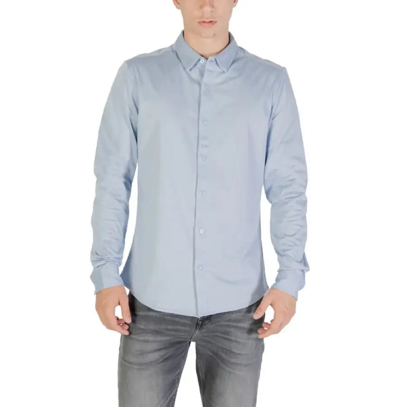 Light blue long sleeved shirt displayed on a retail product listing