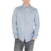 Light blue long sleeved shirt with classic collar and neatly pressed fabric ideal for formal or business wear