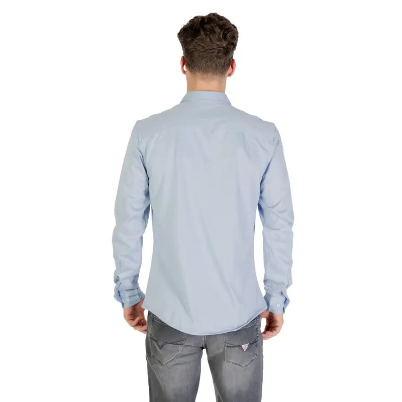 Light blue long sleeved dress shirt with classic collar and buttoned cuffs made of soft breathable fabric