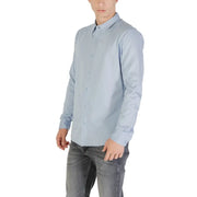 Light blue long sleeved shirt made of cotton fabric ideal for formal and casual wear shown from front side