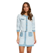 A light blue polyester blazer with round neck and buttons featuring a tweed and denim button-front design