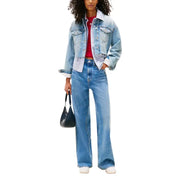 Light blue denim blazer with white collar and cuffs over red top and wide-leg jeans