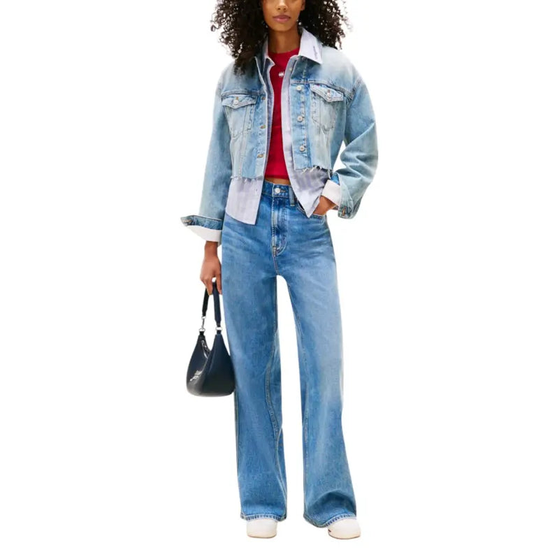 Light blue denim blazer with white collar and cuffs over red top and wide-leg jeans