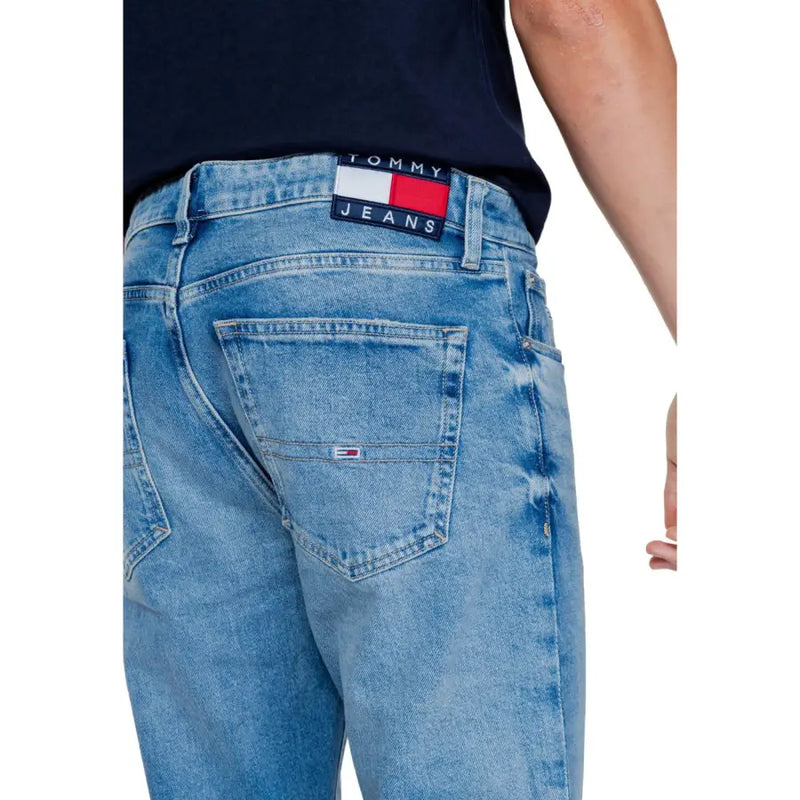 Light blue Tommy Jeans denim jeans displayed for men’s fashion collection