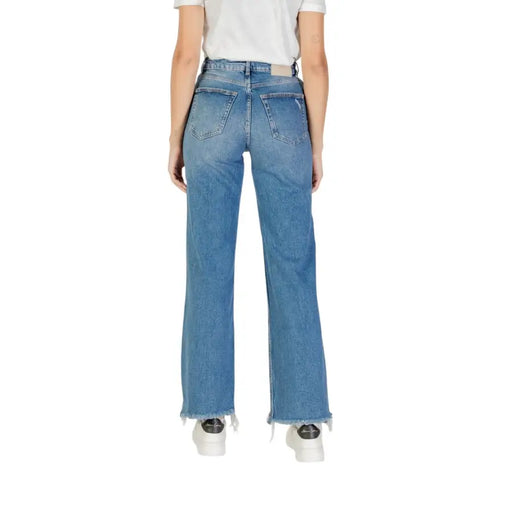 Light blue women’s fall winter wide-leg jeans with frayed hem displayed in product image