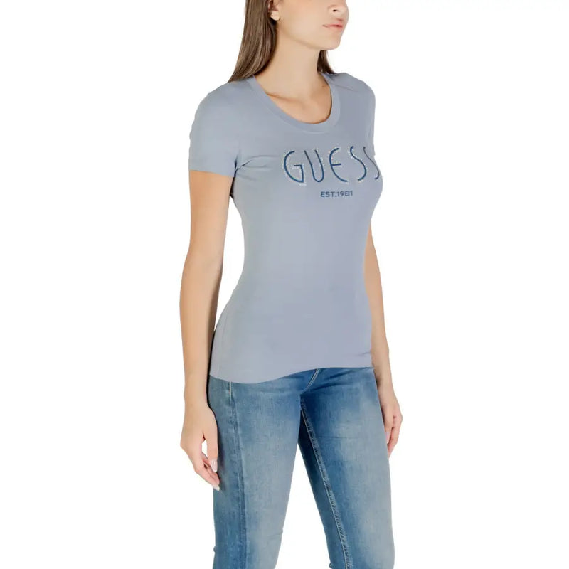 Light blue women’s slim-fit T-shirt with GUESS EST.1981 printed on the front