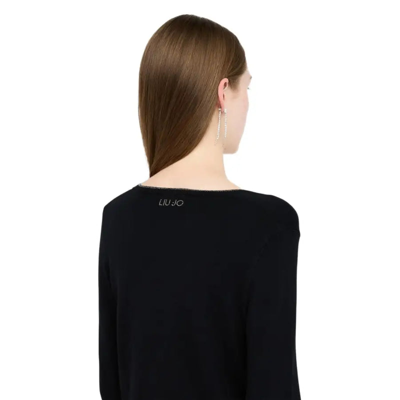 Back side of Liu Jo black knit cardigan with silver embroidered logo on long-sleeved button front top